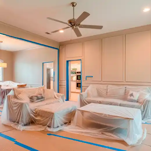 Living room with freshly painted white walls and panel molding.
